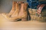 Shoes And Clothes On The Wooden Stock Photo