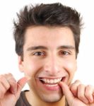 Man Flossing His Teeth Stock Photo