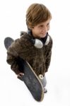 Top View Of Urban Kid Holding Skateboard Stock Photo