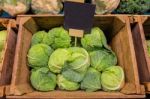 Fresh Cabbage Vegetable In Wooden Box Stall In Greengrocery With Blank Chalkboard Label Stock Photo