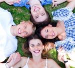 Young Friends Forming A Circle Stock Photo