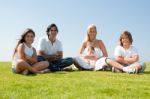 Happy Family Relaxing In Garden Stock Photo