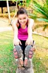 Young Woman Stretching Before Exercise Stock Photo