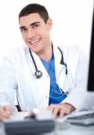 Closeup Shot Of Smiling Young Physician Stock Photo