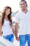 Young Couple Holding Hands Stock Photo