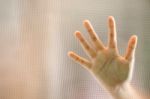 Hand On Frosted Glass Stock Photo