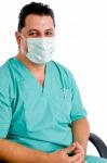 Male Doctor Posing With Face Mask Stock Photo