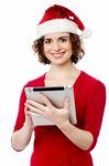 Pretty Woman Browsing Her Tablet Pc Stock Photo