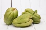 Chayote Fruit On White Wood Background Stock Photo