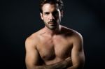 Handsome Muscular Male Model Posing Over Black Background Stock Photo