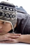 Laying Man Wearing Woollen Cap Stock Photo