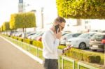 Businessman With Mobile Phone And Tablet In Hands Stock Photo