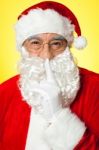 Shh...aged Santa Gesturing Silence Stock Photo