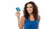 Attractive Woman Displaying Her Credit Card Stock Photo