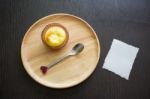 Portuguese Egg Tart On A Wood Dish With White Greeting  Blank Paper Stock Photo