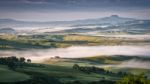 Mist Swirling Through Val D'orcia Stock Photo