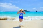 Woman Jumping With Happy On The Beach At Thailand Stock Photo