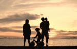 Silhouette Family At Beach Stock Photo