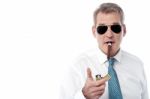 Businessman Lighting A Cigar Stock Photo