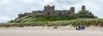 Shoreline View To Bamburgh Castle Stock Photo