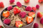 Bran Flakes With Fresh Raspberries And Strawberries Stock Photo