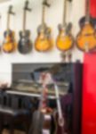 Blurred Quitar And Piano In The Music Room Stock Photo