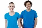 Couple In Blue T-shirts. Isolated Over White Stock Photo