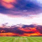 Soccer Field With Beautiful Sunset Background Stock Photo