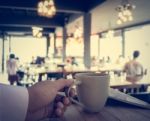 Hand Of Business Man Holding Coffee Cup Stock Photo