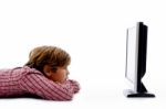 Side Pose Of Boy Watching Tv Stock Photo