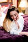 Pretty Shy Lady Relaxing In Bathrobe Stock Photo