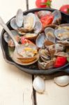 Fresh Clams On An Iron Skillet Stock Photo