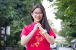 Portrait Of Thai Teen Beautiful Girl In Chinese Dress, Relax And Smile Stock Photo