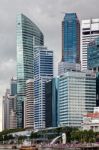 Merlion Fountain And Skyscrapers In Singapore Stock Photo