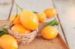 Yellow Fruit On Wooden Stock Photo