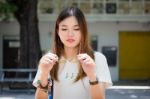 Portrait Of Thai Chinese Adult Glasses Beautiful Girl Denim Blue Bag Relax And Smile Stock Photo