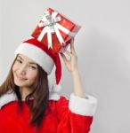 Santa Claus Hat With Red Christmas Gift Box Stock Photo