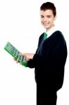 School Boy Using Calculator Stock Photo