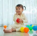 Little Asian Girl In Home Stock Photo