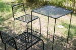 Outdoor Tables And Chairs Set Up On The Green Lawn Stock Photo