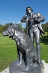 Statue Of A Man And Two Dogs At The Imperial Kaiservilla In Bad Stock Photo