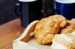 Bread And Cup On Table Stock Photo