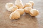 Salted Peanuts On Weathered Wood Stock Photo