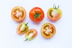 Fresh Tomatoes On White Wooden Background Stock Photo