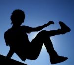 Boy Jumping Silhouette Stock Photo