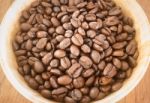 Roasted Coffee Bean In Bowl Stock Photo