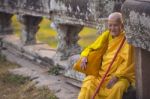 An Unidentified Old Buddhist Female Monk Dressed In Orange Toga Stock Photo