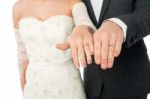 Bride And Groom Showing Their Wedding Rings Stock Photo