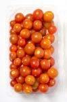 Cherry Tomato In Plastic Container Package, Studio Shoot On Whit Stock Photo