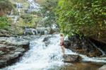 The Man Standing At Mae Ya Waterwall Stock Photo